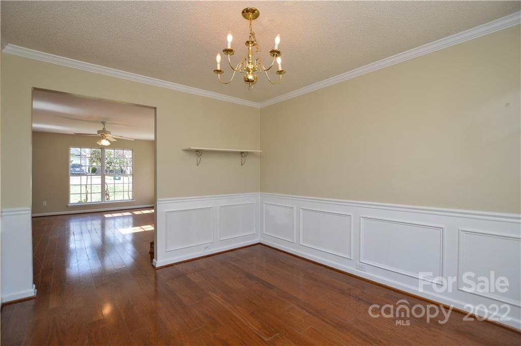 7608 Henderson Park Road Huntersville, NC 28078 - Photo 11 of 39 a view of an empty room with wooden floor