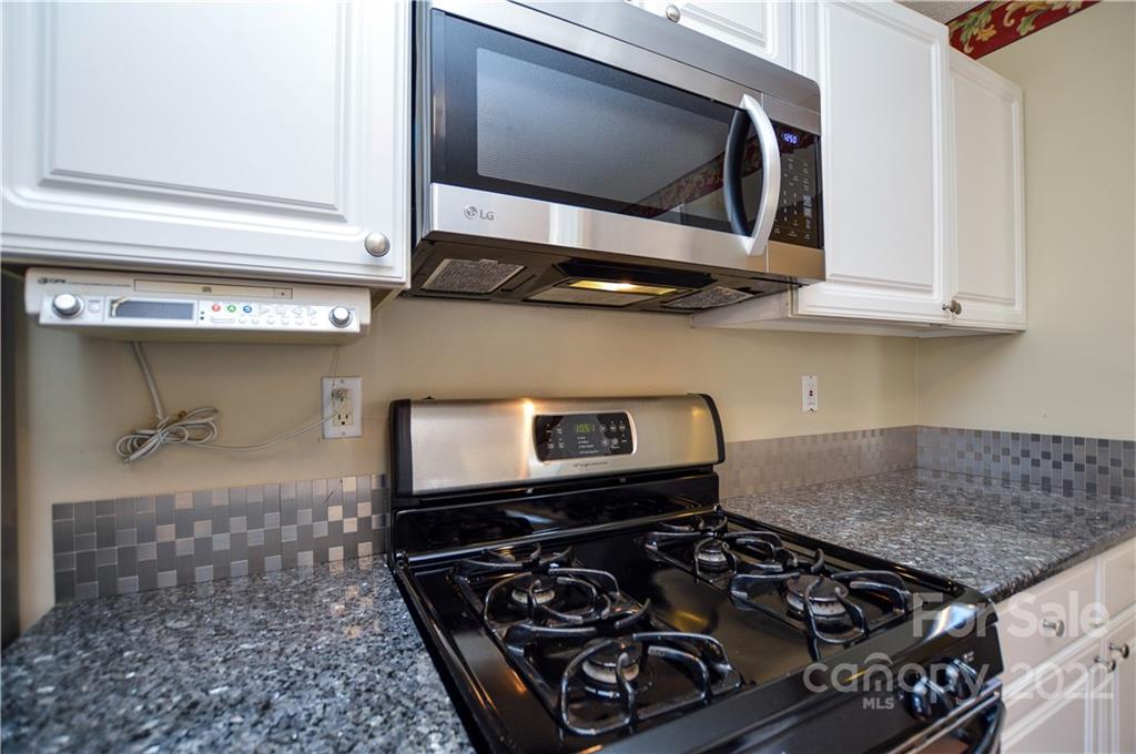 7608 Henderson Park Road Huntersville, NC 28078 - Photo 15 of 39 a kitchen with a stove and a microwave