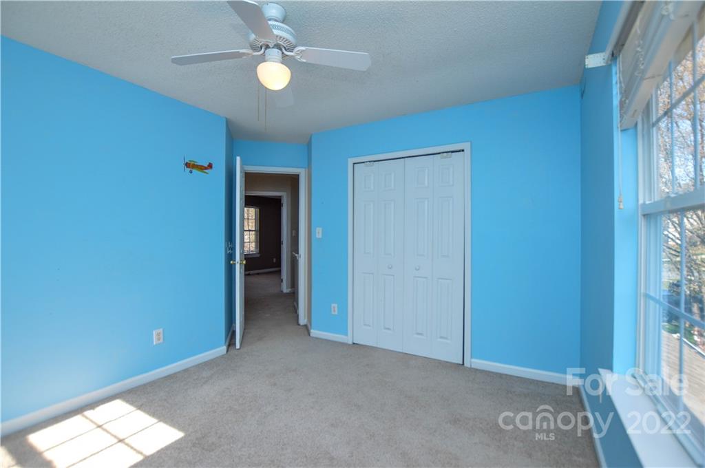 7608 Henderson Park Road Huntersville, NC 28078 - Photo 20 of 39 an empty room with closet and a window