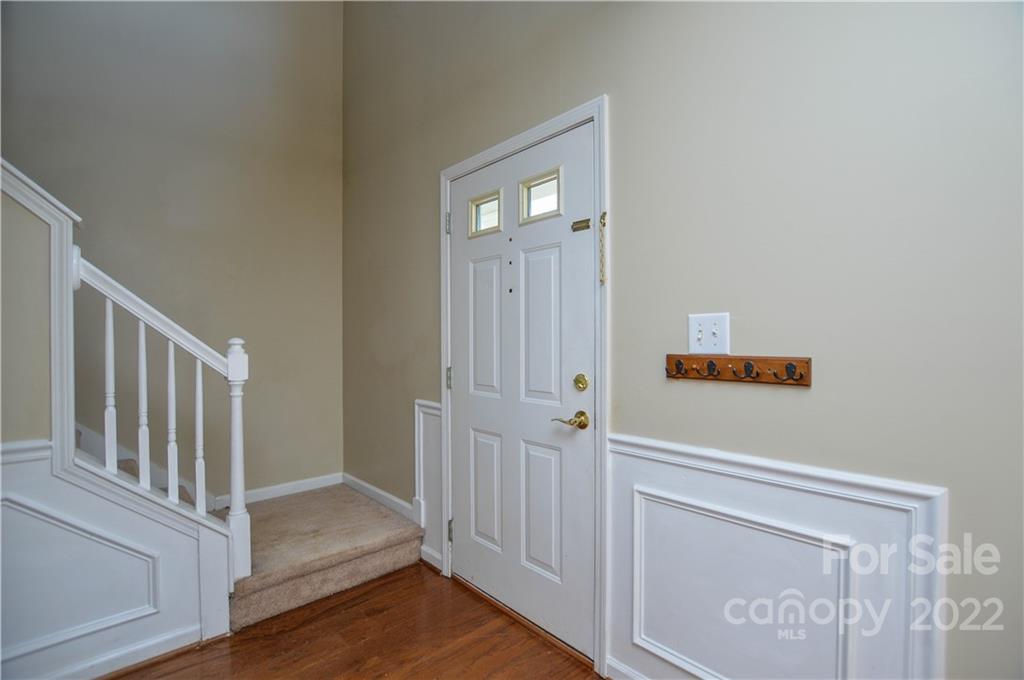 7608 Henderson Park Road Huntersville, NC 28078 - Photo 4 of 39 a view of a hallway with wooden floor and entryway