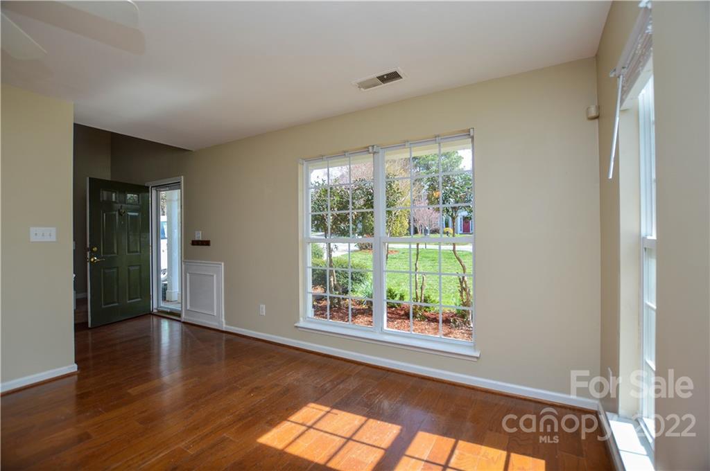 7608 Henderson Park Road Huntersville, NC 28078 - Photo 5 of 39 a view of an empty room with wooden floor and a window