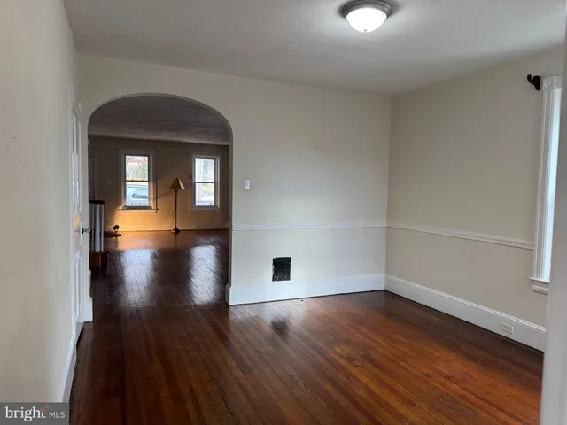 a view of a living room with hardwood floor