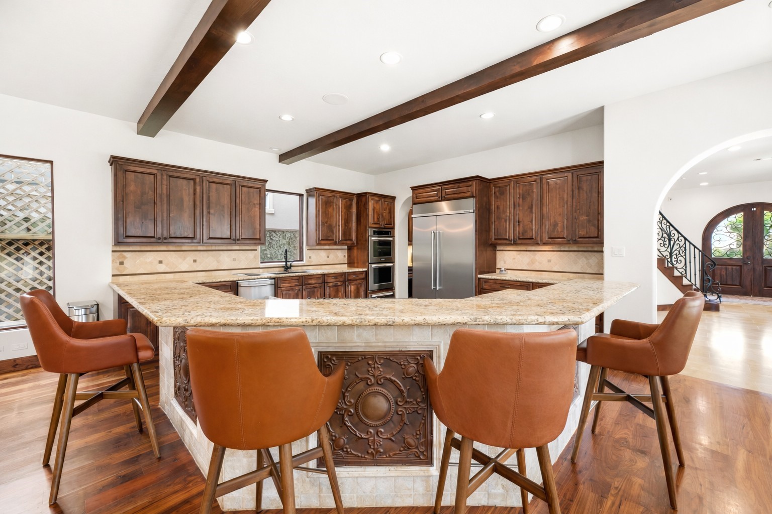 3803 Drake Street Houston, TX 77005 - Photo 10 of 32 a kitchen with granite countertop wooden cabinets and chairs