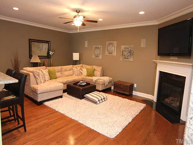 This room is even bigger than the picture shows- But it is a cozy room too, with the gas log fireplace, recessed lighting. It's a great place to snuggle by the fire and read a book. Plenty of room for your sectional too! Notice the built-in speakers.. Den/Family/Great Room