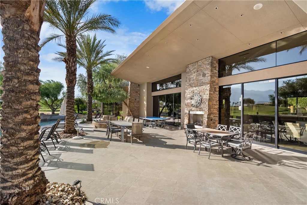 68 Royal St Georges Way Rancho Mirage, CA 92270 - Photo 2 of 75 a row of palm trees in front of a building