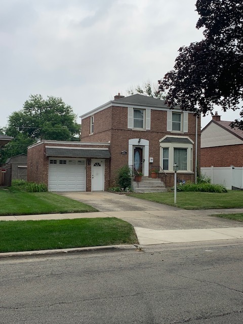 2247 South 3rd Avenue North Riverside, IL 60546 - Photo 1 of 19 a front view of a house with a garden and plants