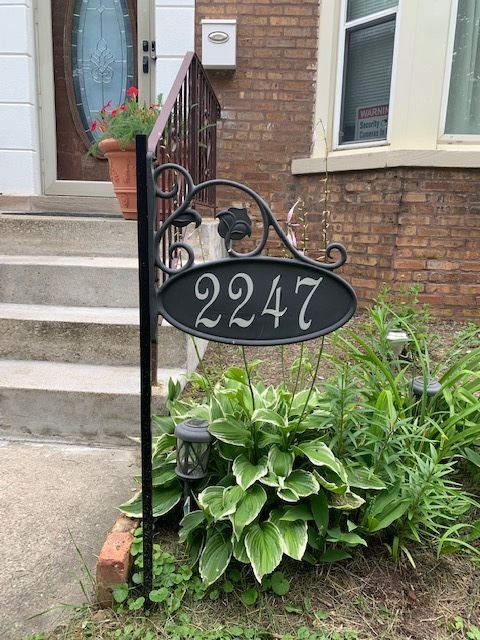 2247 South 3rd Avenue North Riverside, IL 60546 - Photo 2 of 19 a street sign on a brick wall