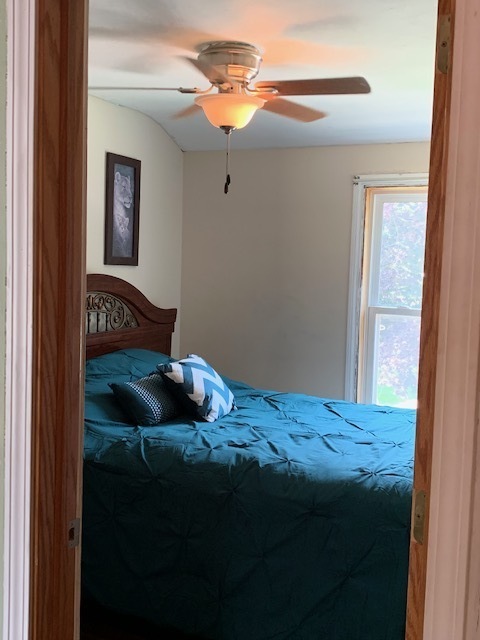 2247 South 3rd Avenue North Riverside, IL 60546 - Photo 12 of 19 a bedroom with a bed and a chandelier