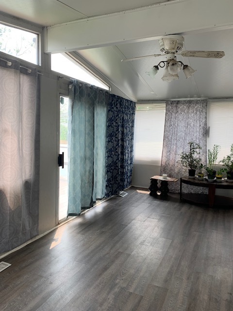 2247 South 3rd Avenue North Riverside, IL 60546 - Photo 19 of 19 a view of a room with wooden floor and a ceiling fan