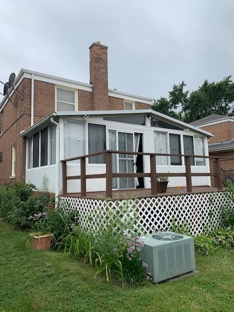 2247 South 3rd Avenue North Riverside, IL 60546 - Photo 9 of 19 a front view of a house with a garden