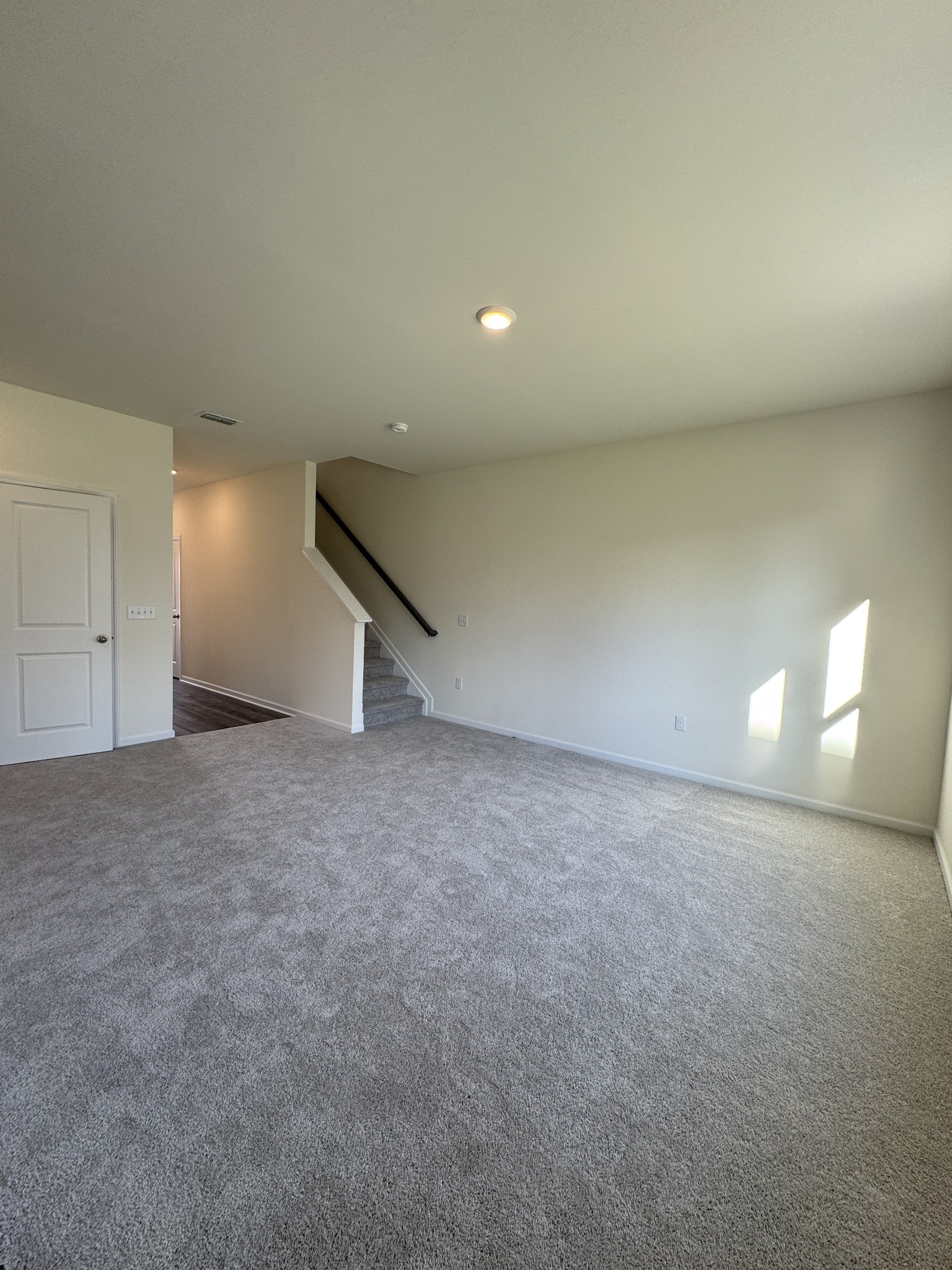159 Snowdrop Avenue La Vergne, TN 37086 - Photo 3 of 16 a view of an empty room with a lamp