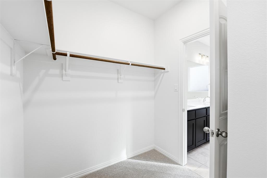 1244 Sabine River Lane Springtown, TX 76082 - Photo 14 of 26 Spacious closet featuring light tile patterned floors