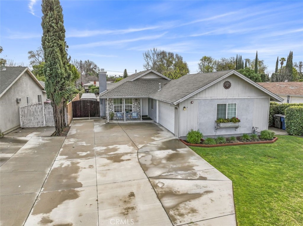 5462 Grand Avenue Riverside, CA 92504 - Photo 1 of 1 a front view of a house with a garden