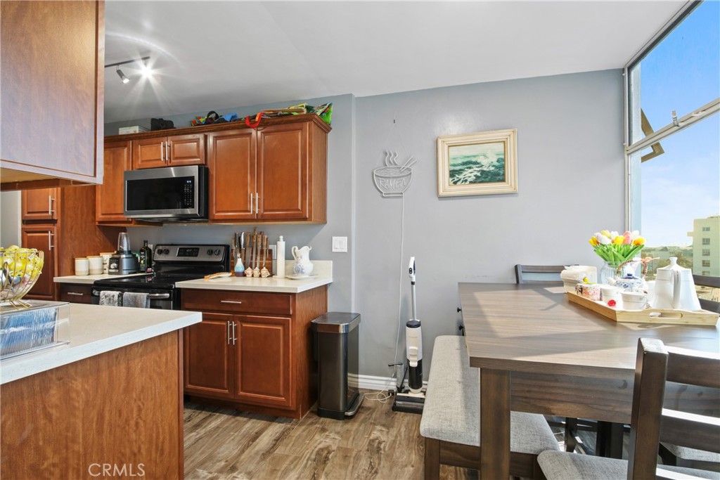 100 Atlantic Avenue, Unit 609 Long Beach, CA 90802 - Photo 6 of 10 a kitchen with a sink stove and cabinets