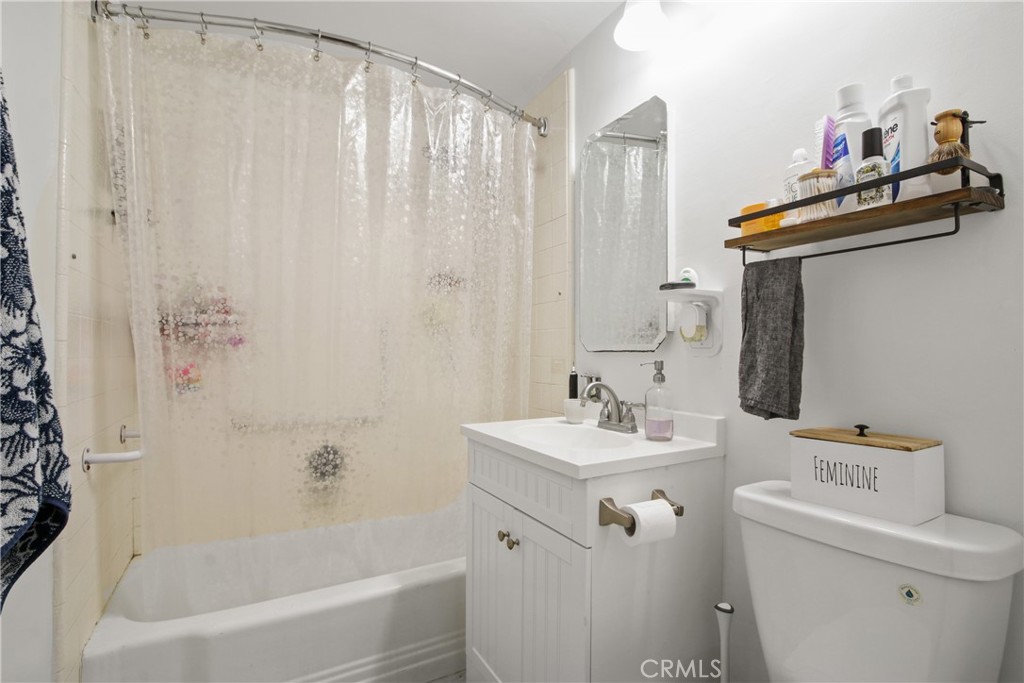 100 Atlantic Avenue, Unit 609 Long Beach, CA 90802 - Photo 8 of 10 a bathroom with a sink toilet and shower