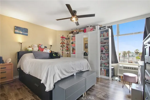 a bed room with a bed and a chair