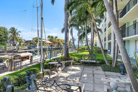 a view of a yard with a table and chairs