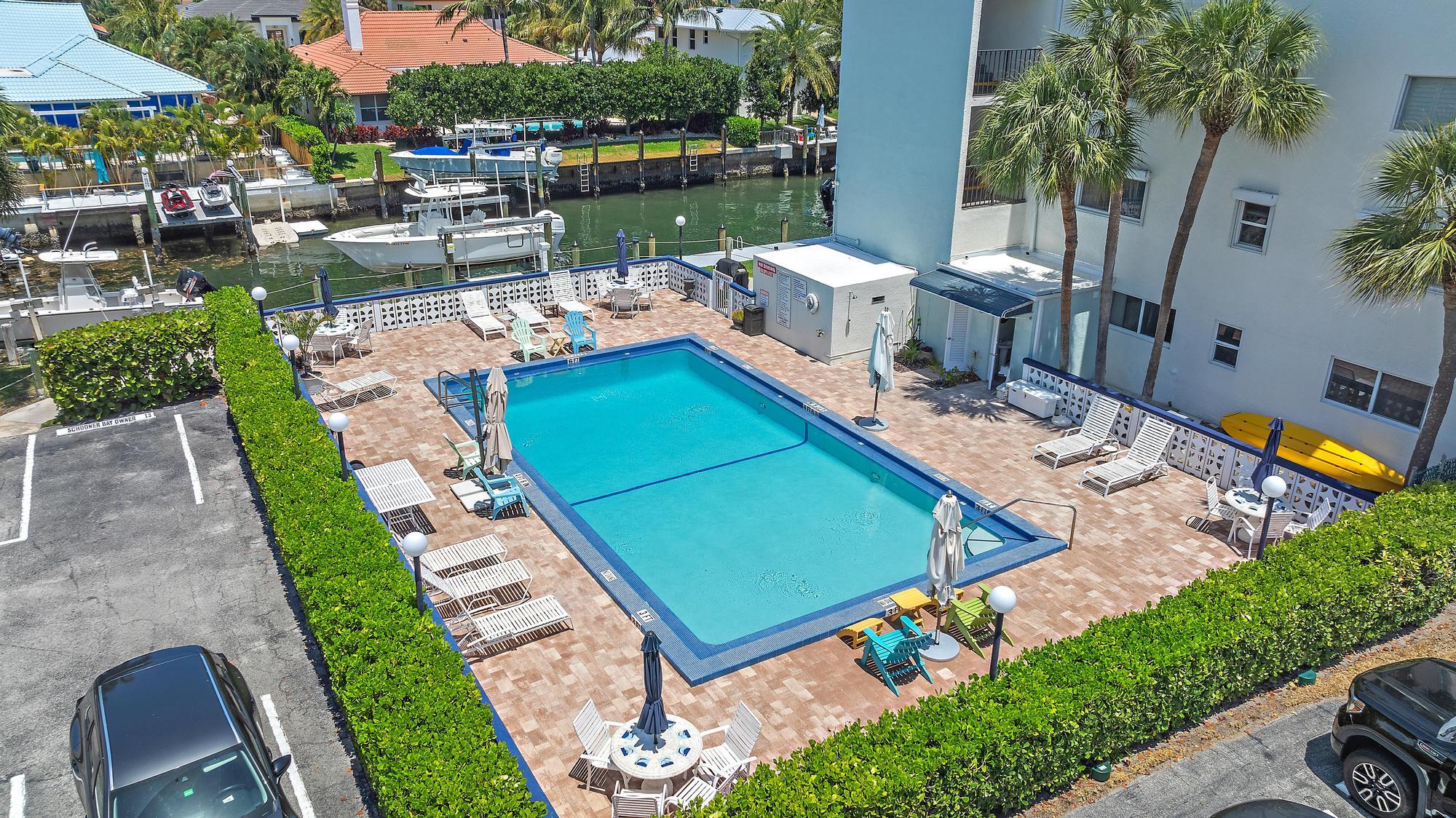 109 Paradise Harbour Boulevard, Unit 307 North Palm Beach, FL 33408 - Photo 19 of 20 a view of a backyard with sitting area