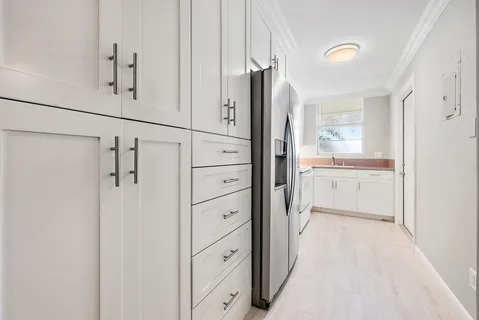a bathroom with a shower sink and mirror