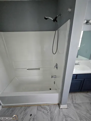 a bathroom with a bathtub