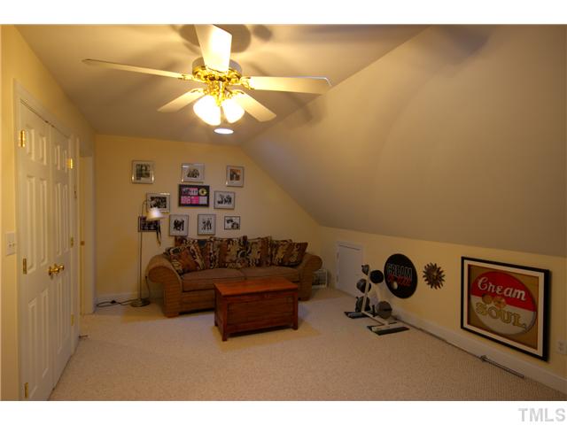 11700 John Allen Road Raleigh, NC 27614 - Photo 19 of 22 a living room with couch and a chandelier