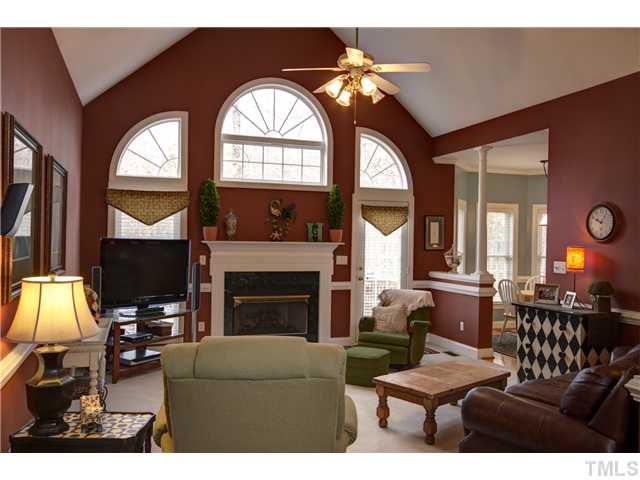 11700 John Allen Road Raleigh, NC 27614 - Photo 5 of 22 a living room with furniture a fireplace and a large window