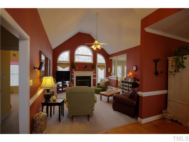 11700 John Allen Road Raleigh, NC 27614 - Photo 7 of 22 a living room with furniture a fireplace and a chandelier