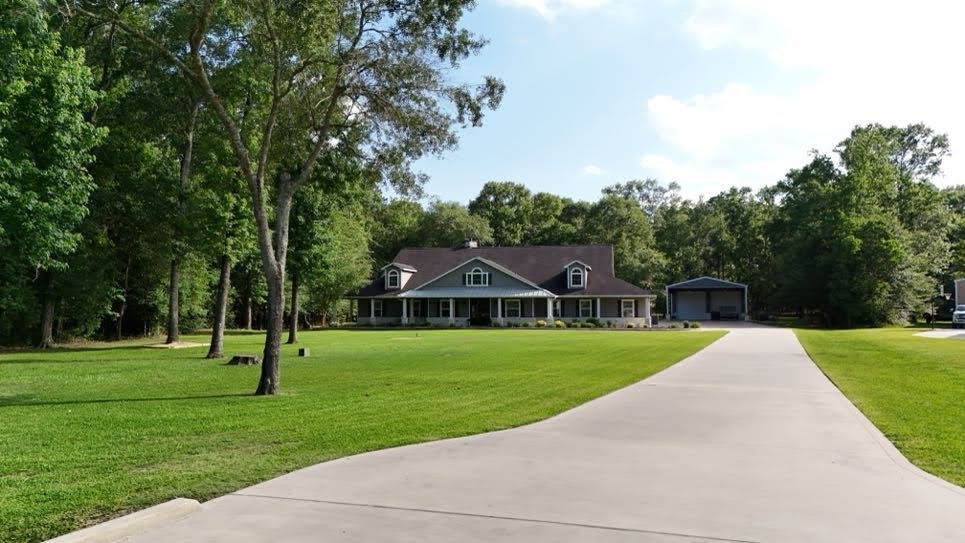 0 Riverview Crossing Huffman, TX 77336 - Photo 6 of 11 a front view of a house with a yard