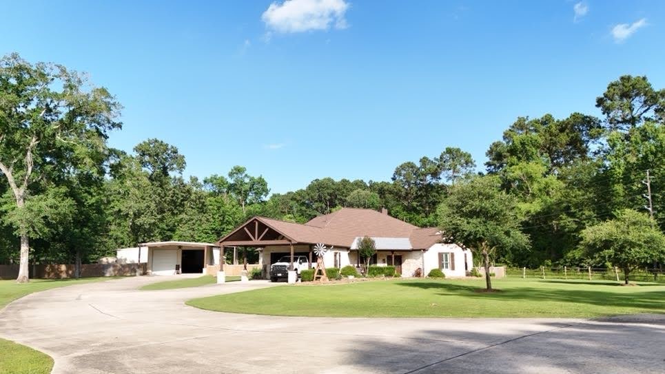 0 Riverview Crossing Huffman, TX 77336 - Photo 10 of 11 a front view of a house with a garden
