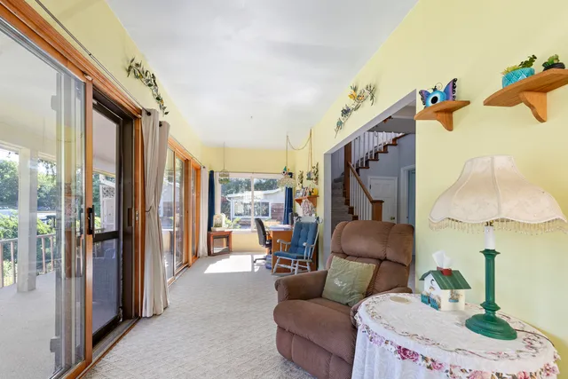 a view of entryway with livingroom and stairs