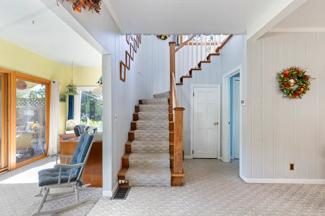 a bedroom with a bed window and a table