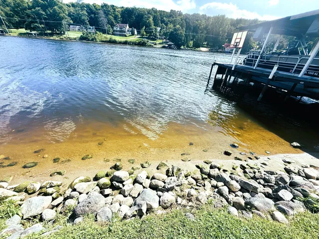 a view of a lake with a yard