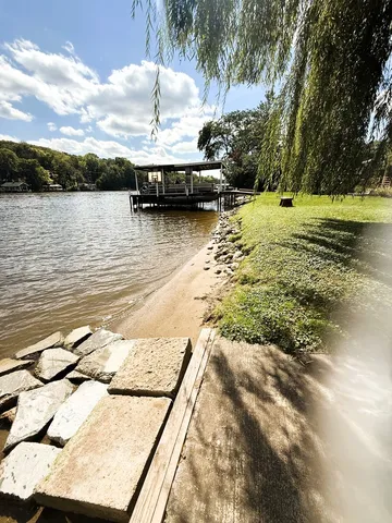 a view of a lake with a yard