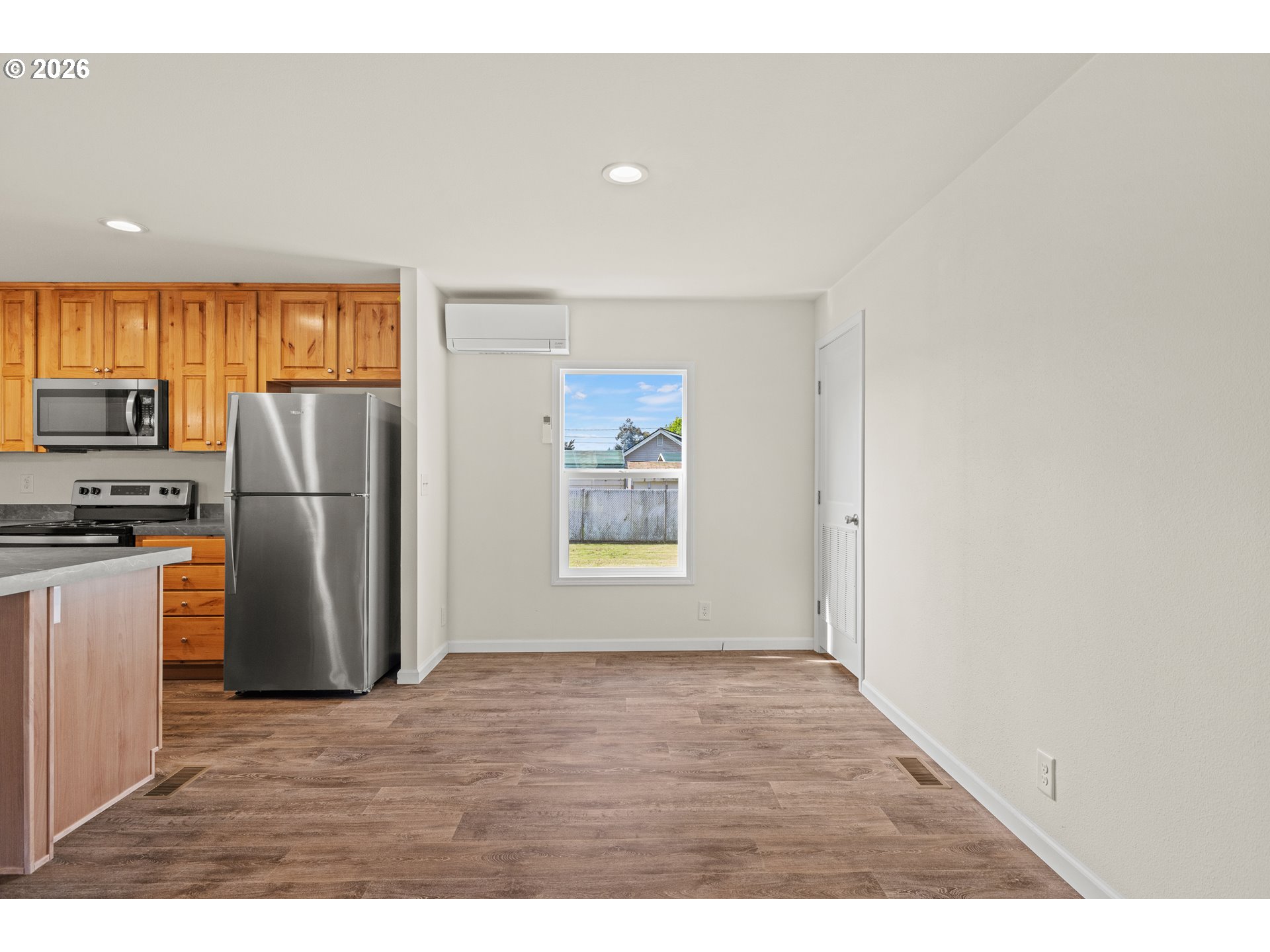 1314 Bothwick Street Myrtle Point, OR 97458 - Photo 11 of 38 a view of kitchen with stainless steel appliances wooden floor and a refrigerator