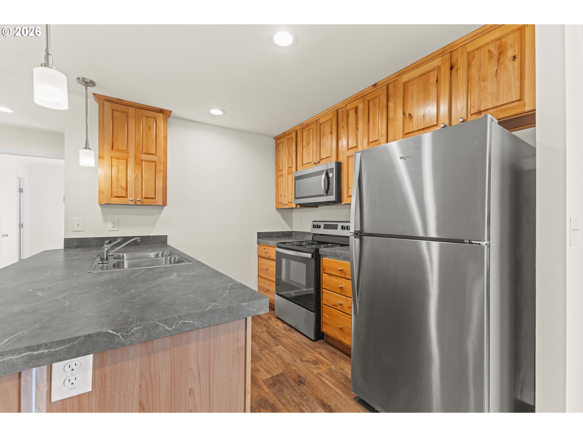 1314 Bothwick Street Myrtle Point, OR 97458 - Photo 12 of 38 a kitchen with refrigerator cabinets and a counter top space