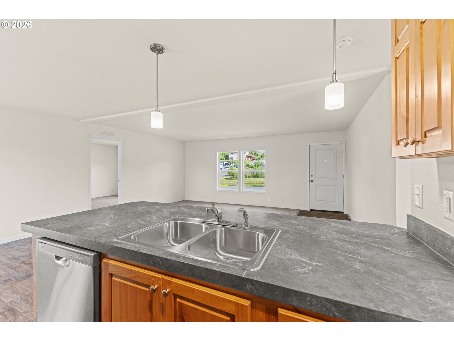 1314 Bothwick Street Myrtle Point, OR 97458 - Photo 13 of 38 a kitchen with a sink cabinets and window