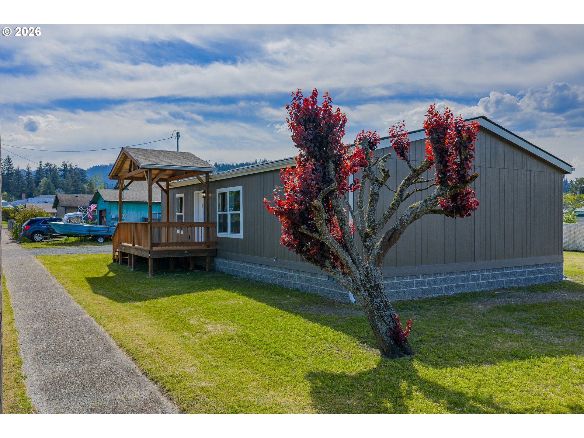 1314 Bothwick Street Myrtle Point, OR 97458 - Photo 2 of 38 a view of a house with a backyard