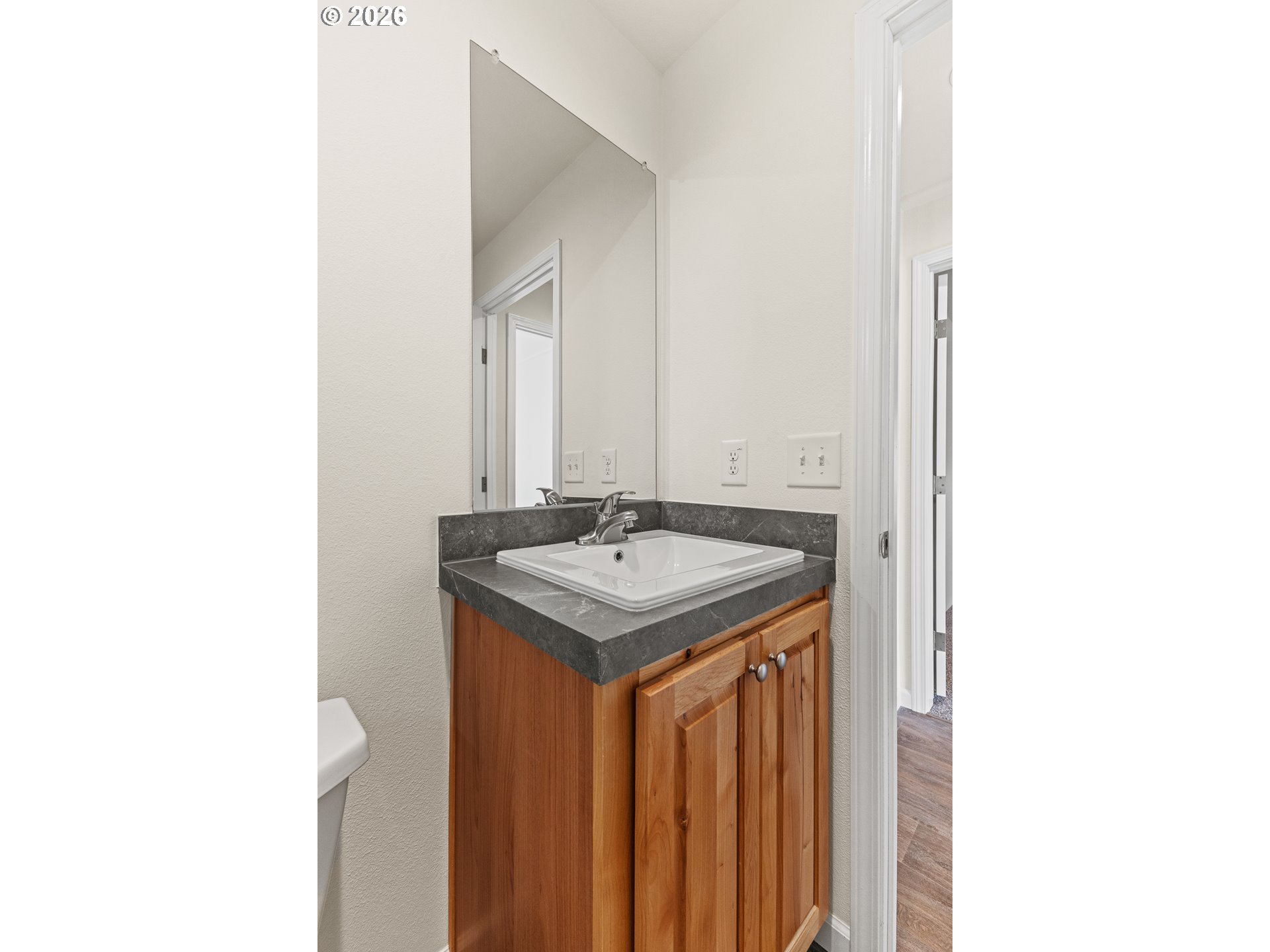 1314 Bothwick Street Myrtle Point, OR 97458 - Photo 28 of 38 a bathroom with a granite countertop sink and a mirror