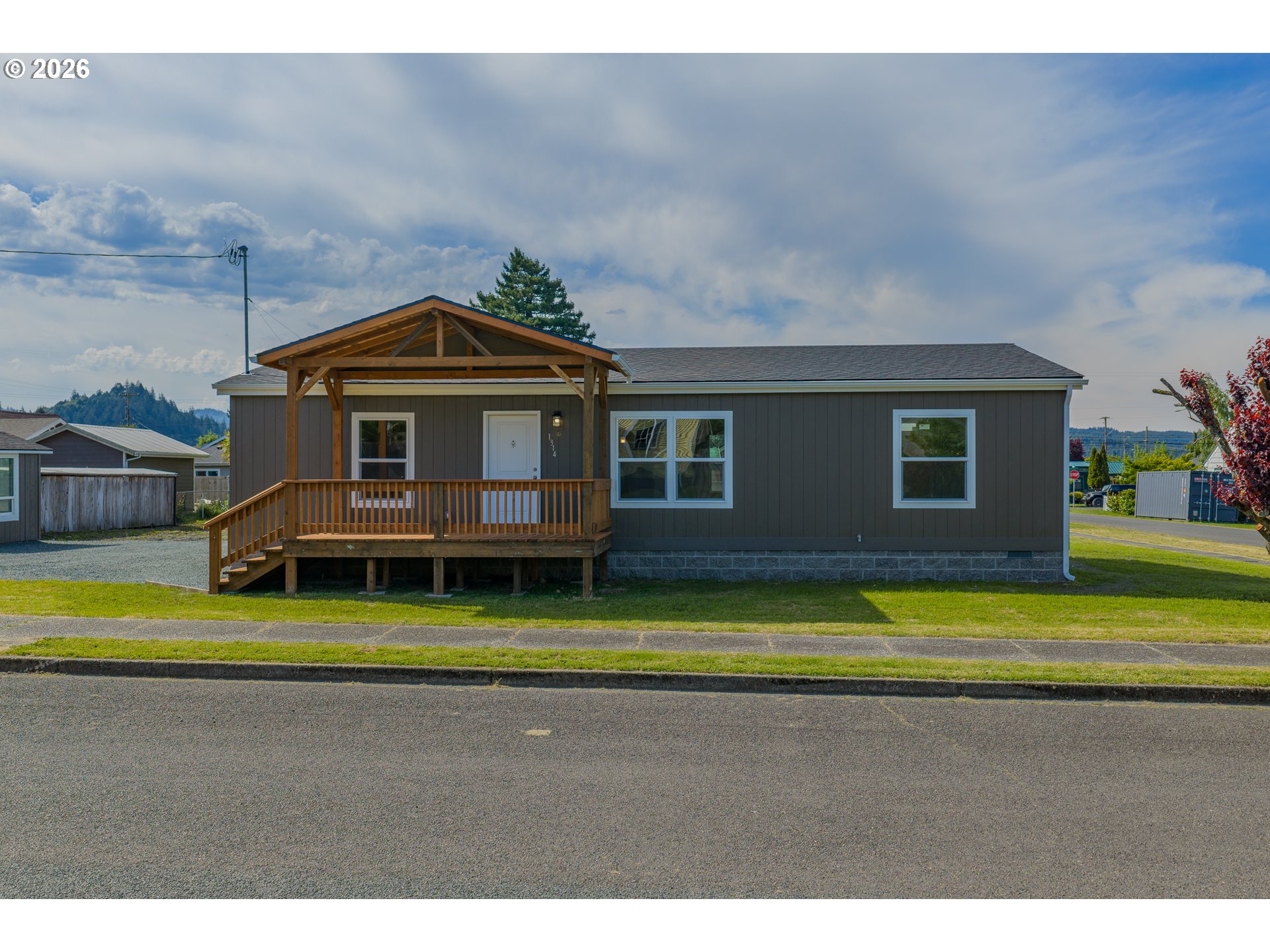 1314 Bothwick Street Myrtle Point, OR 97458 - Photo 3 of 38 a front view of a house with a yard