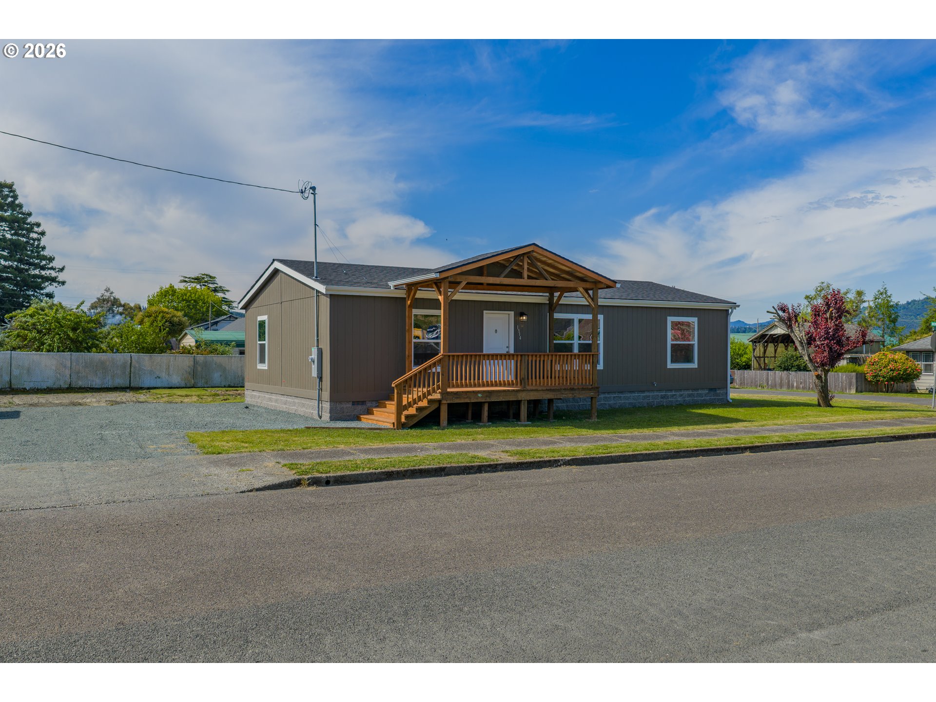 1314 Bothwick Street Myrtle Point, OR 97458 - Photo 33 of 38 a front view of a house with a yard