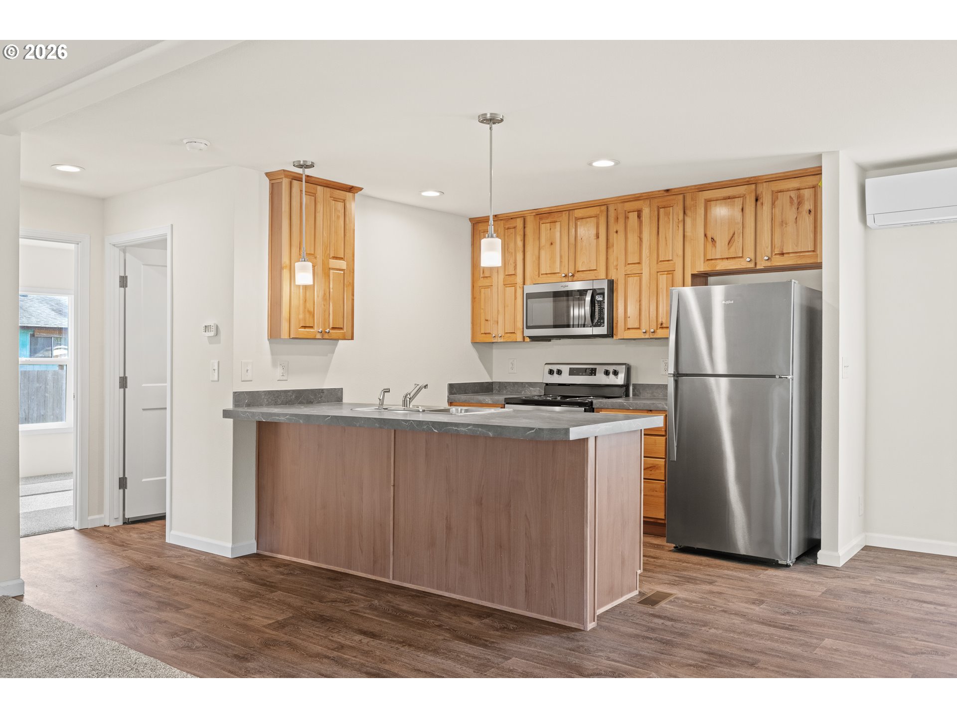 1314 Bothwick Street Myrtle Point, OR 97458 - Photo 10 of 38 a kitchen with stainless steel appliances granite countertop a refrigerator a sink and a stove