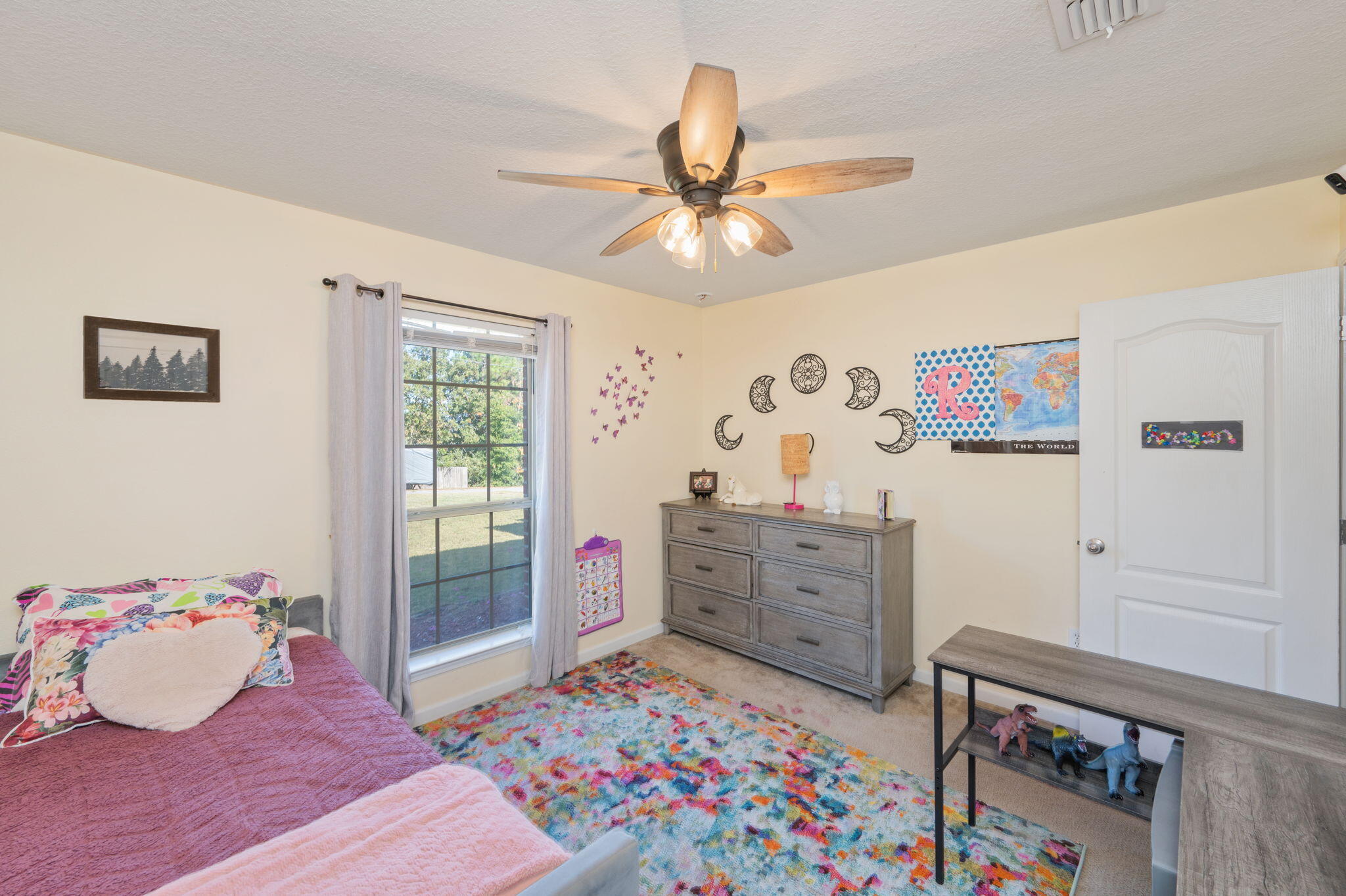2613 Corner Creek Road Crestview, FL 32536 - Photo 12 of 22 a bedroom with a bed and a dresser