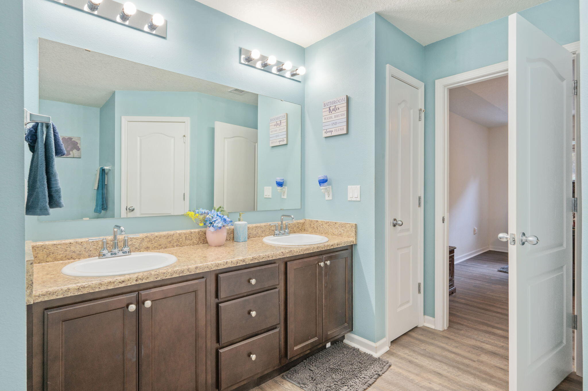 2613 Corner Creek Road Crestview, FL 32536 - Photo 16 of 22 a bathroom with a double vanity sink and mirror with shower