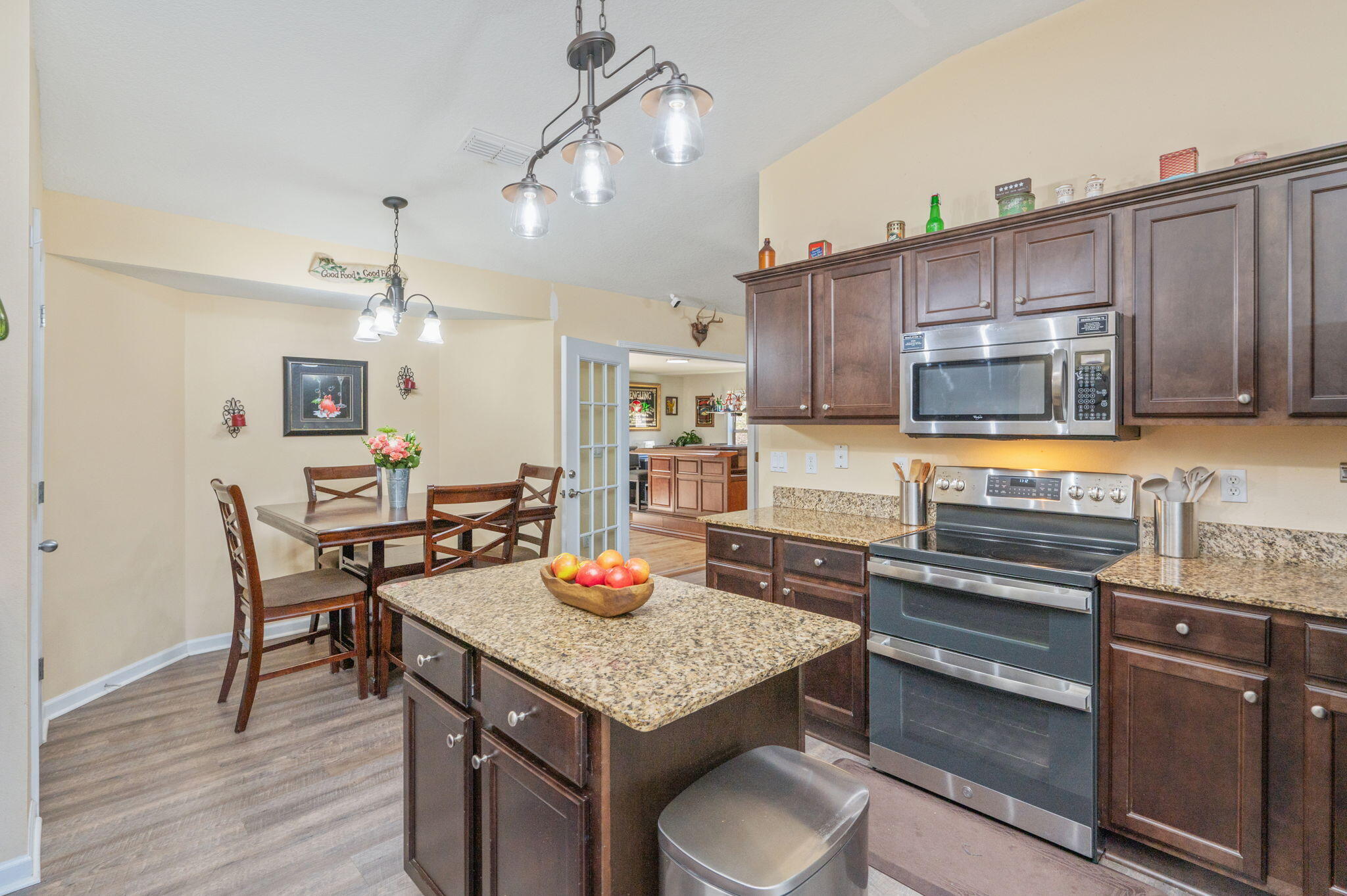2613 Corner Creek Road Crestview, FL 32536 - Photo 7 of 22 a kitchen with granite countertop stainless steel appliances and wooden cabinets