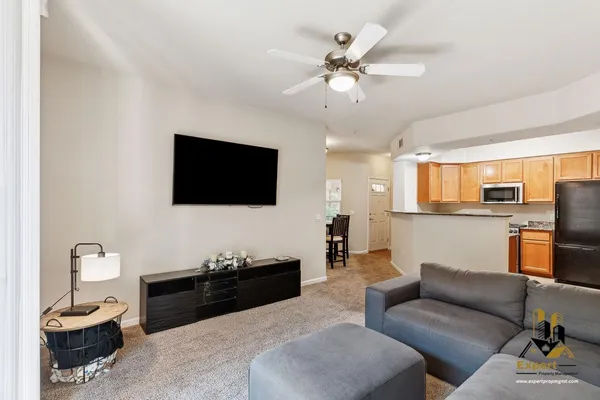 a living room with furniture and a flat screen tv