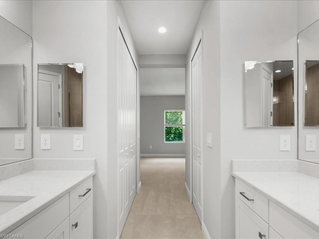 2119 Marquesa Circle Naples, FL 34112 - Photo 25 of 44 a bathroom with a sink and a mirror