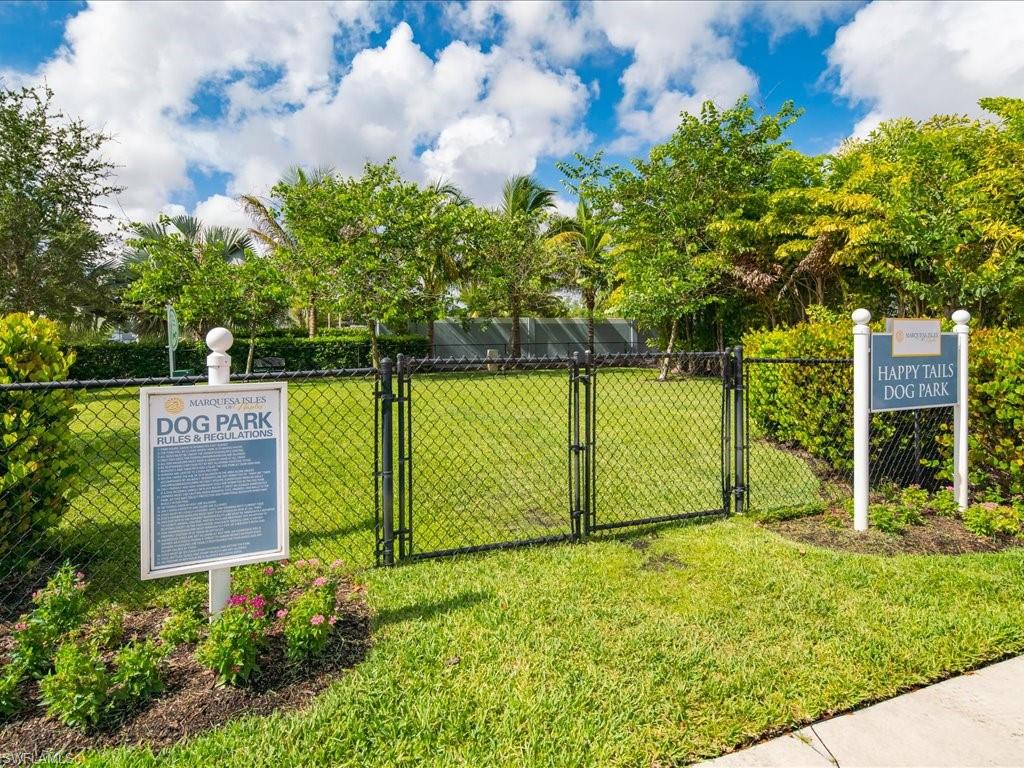 2119 Marquesa Circle Naples, FL 34112 - Photo 40 of 44 a view of a yard with wooden fence