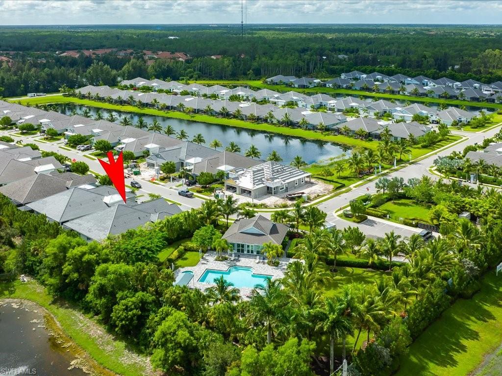 2119 Marquesa Circle Naples, FL 34112 - Photo 42 of 44 a view of a lake with a lot of trees and houses