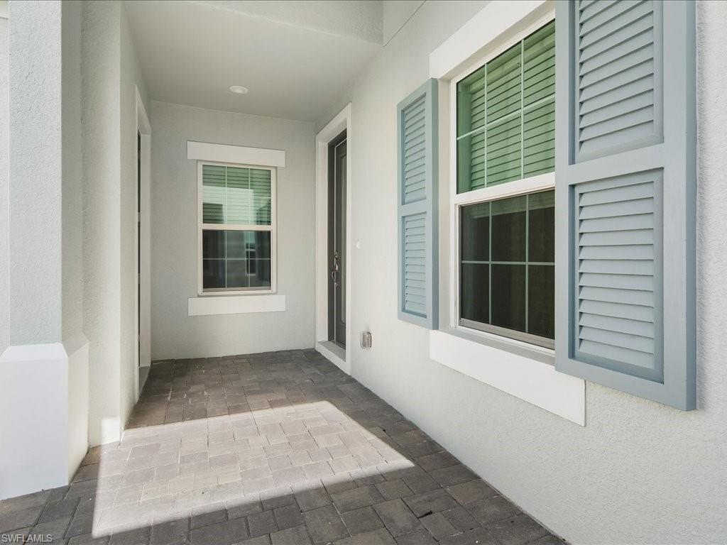 2119 Marquesa Circle Naples, FL 34112 - Photo 7 of 44 a view of house with front door