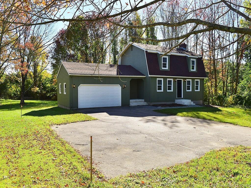 29 Pickerel Lake Road Colchester, CT 06415 - Photo 1 of 1 a front view of a house with a yard and garage